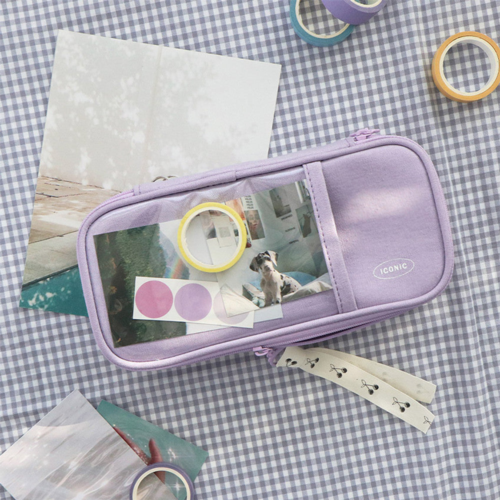 The Journal Shop - Lavender pen pouch open on a gingham cloth surface with stationery and decorative items.