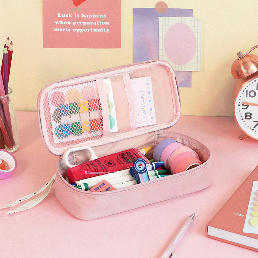 The Journal Shop - Open pastel pink pen pouch on a pink background with stationery essentials inside.
