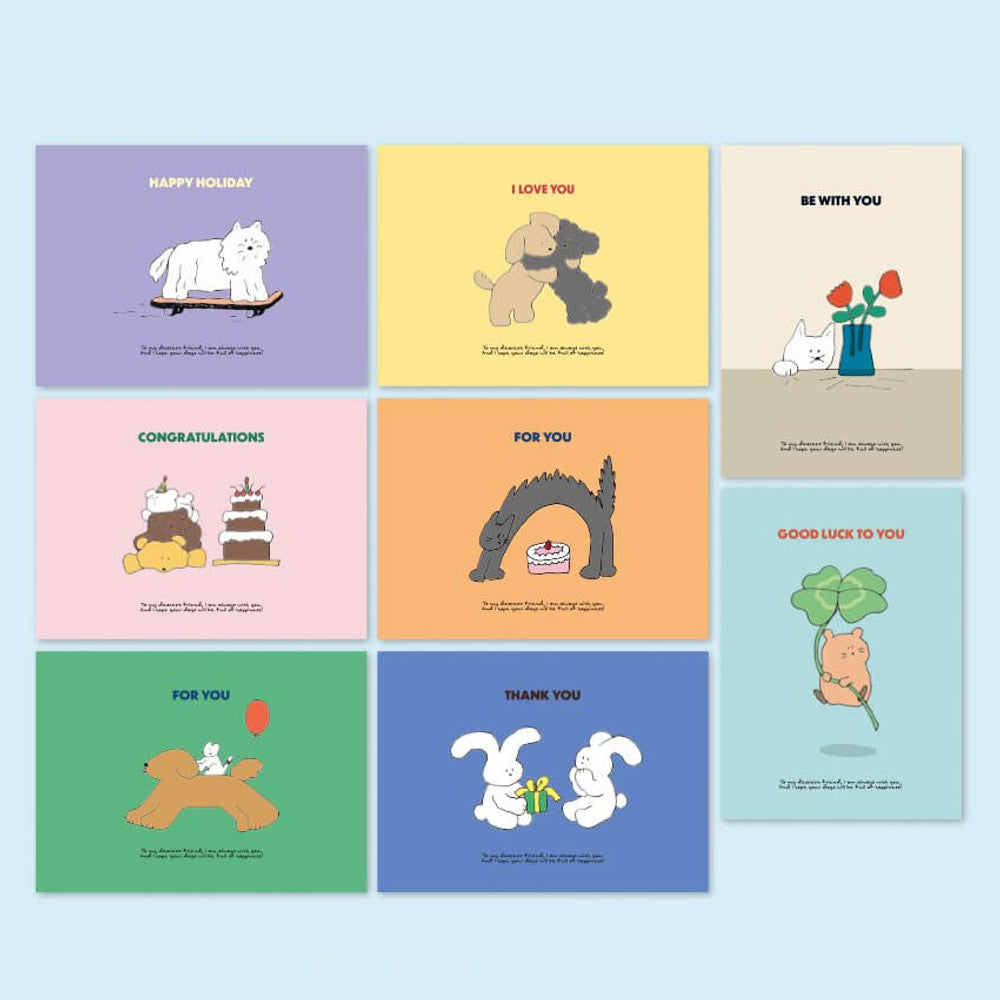 The Journal Shop - Iconic Cuddly Message Cards in various pastel colours with dog and cat designs displayed on desk.