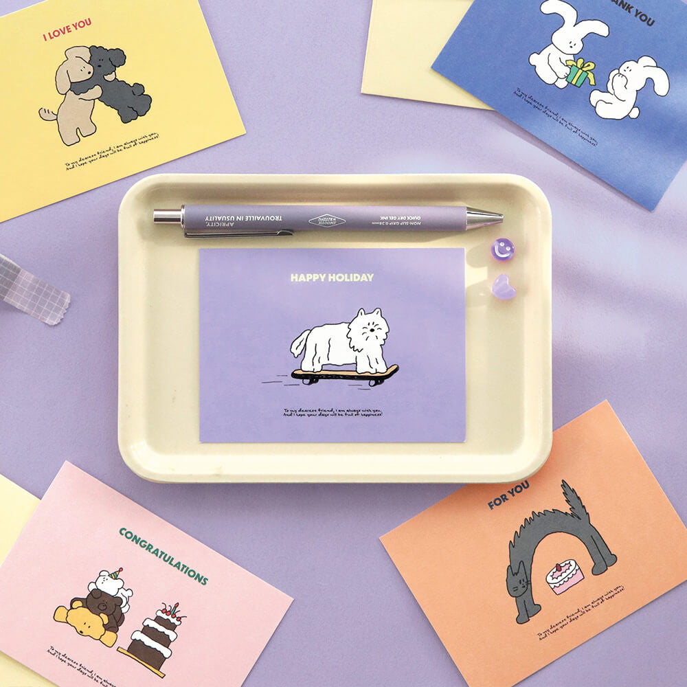 The Journal Shop - Iconic Cuddly Message Cards and envelopes displayed around cream tray with pastel background.