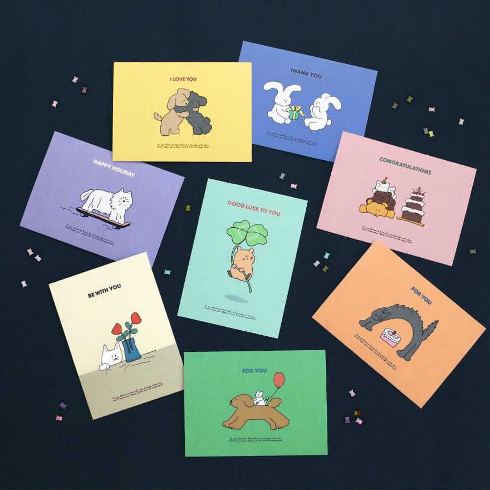 The Journal Shop - Iconic Cuddly Message Cards in bright pastel shades with animal illustrations displayed on dark blue background.