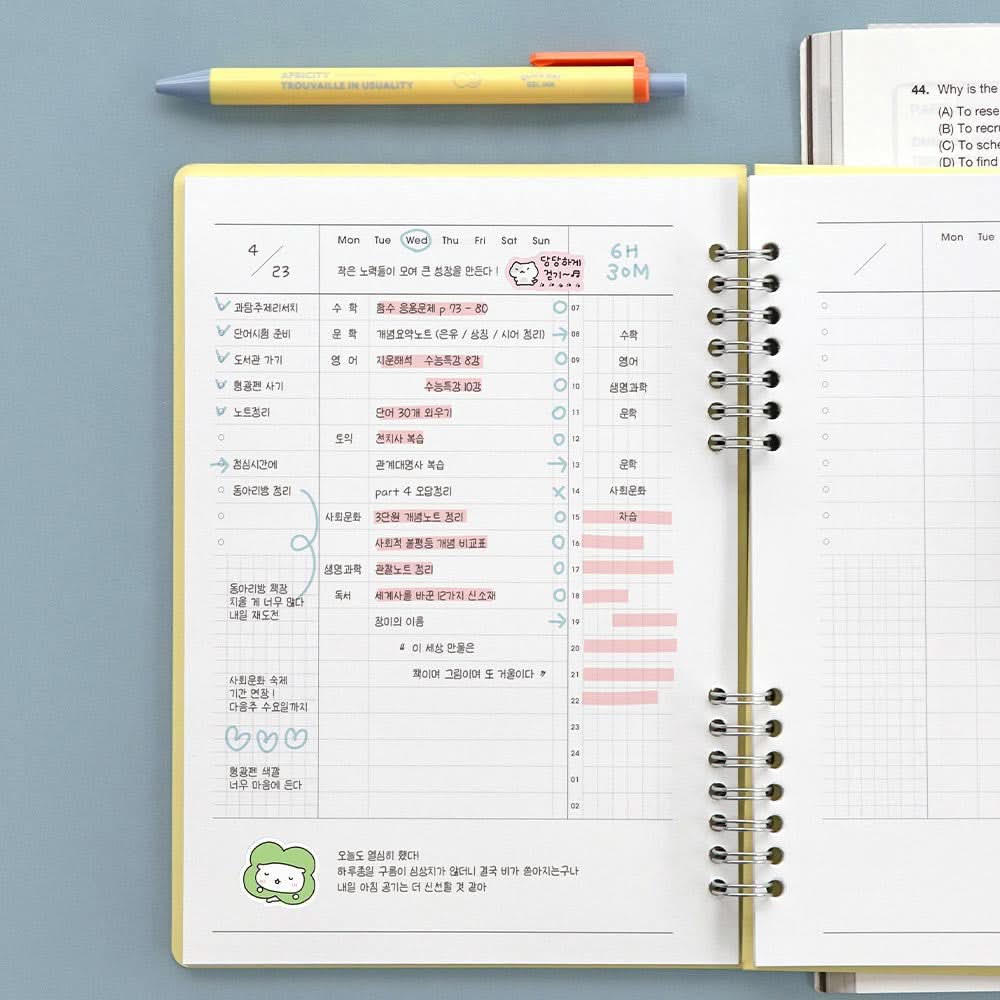 The Journal Shop - Iconic Daily A5 Study Planner notebook weekly spread with ruled sections for tasks and timetables.