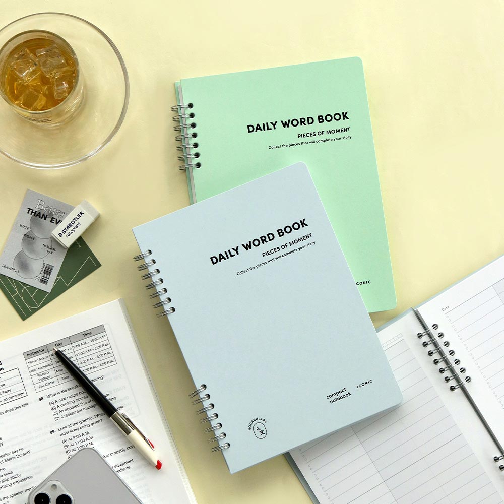 The Journal shop - Iconic Daily A5 Word Book vocabulary learning notebook in mint green cover with pen and tea on desk.