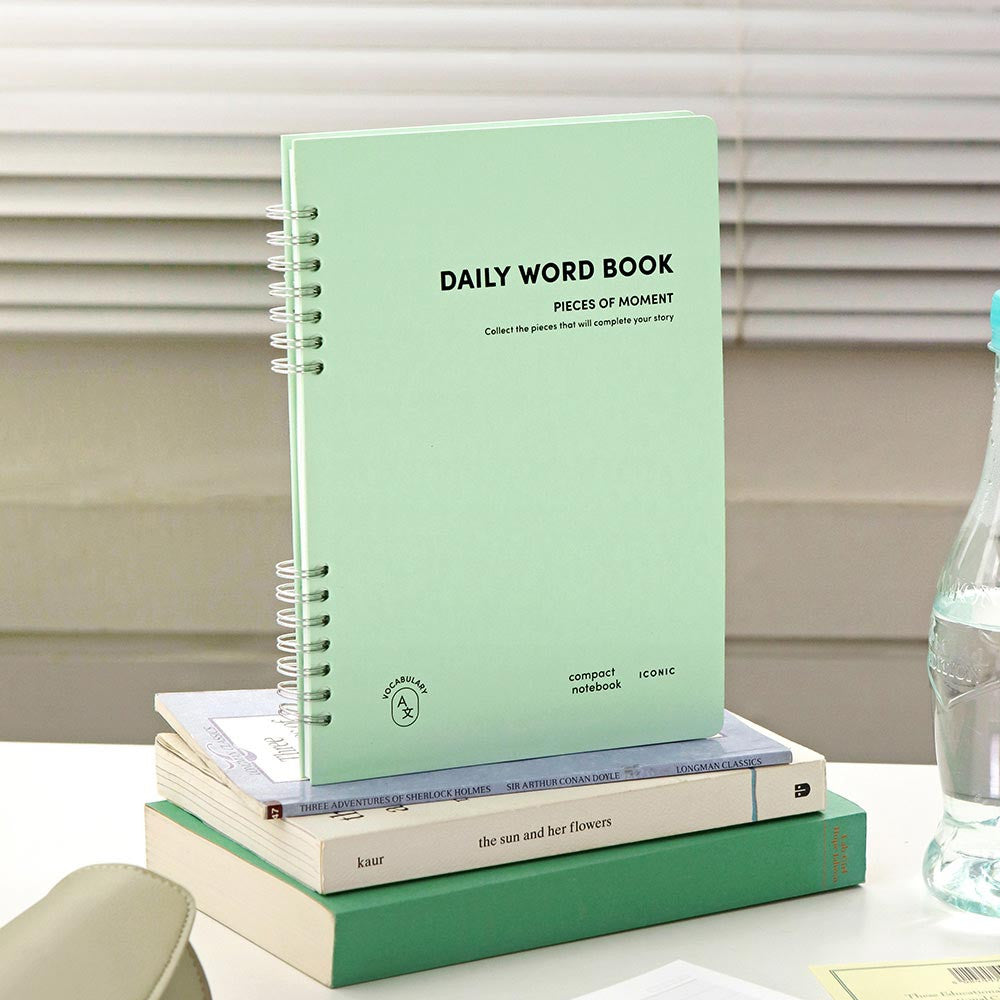 The Journal shop - Iconic Daily A5 Word Book vocabulary learning notebook in mint green cover standing on desk.