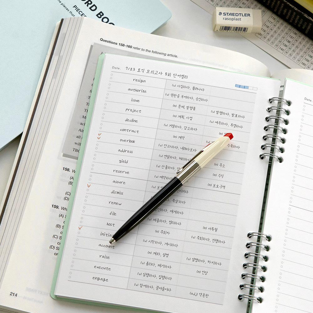 The Journal shop - Iconic Daily A5 Word Book vocabulary learning notebook open on desk with pencil.