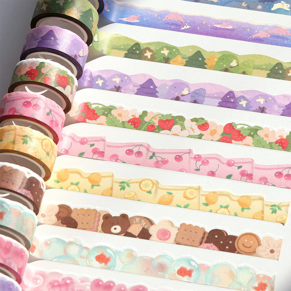 The Journal Shop - Collection of Iconic Die-Cut Paper Masking Tapes in various pastel designs displayed in multiple rolls and strips.