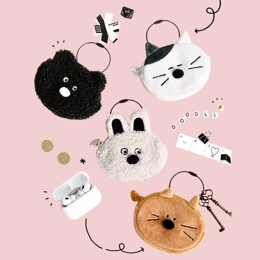 The Journal Shop - Collection of Iconic Doodle Compact Keyring Pouches in the shape of cute animal faces, displayed on a pink background with small accessories.