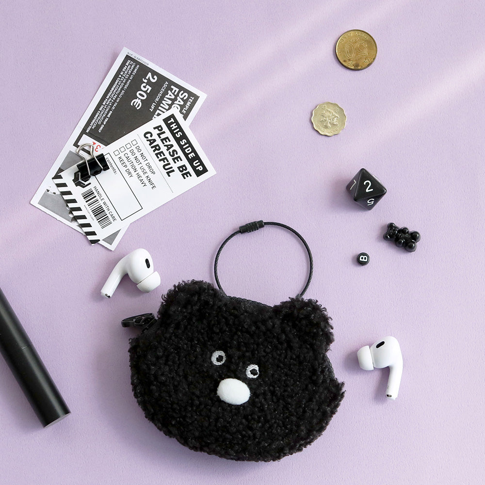 The Journal Shop - Black Doodle Keyring Pouch with animal face design placed beside stationery and coins on a lilac background.