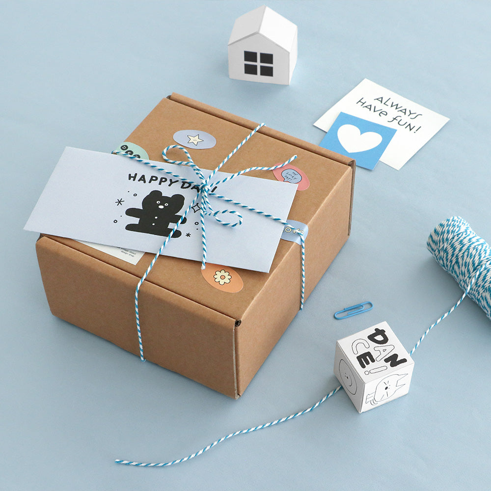 The Journal Shop - Gift box decorated with Iconic Doodle stickers and envelope on the top.