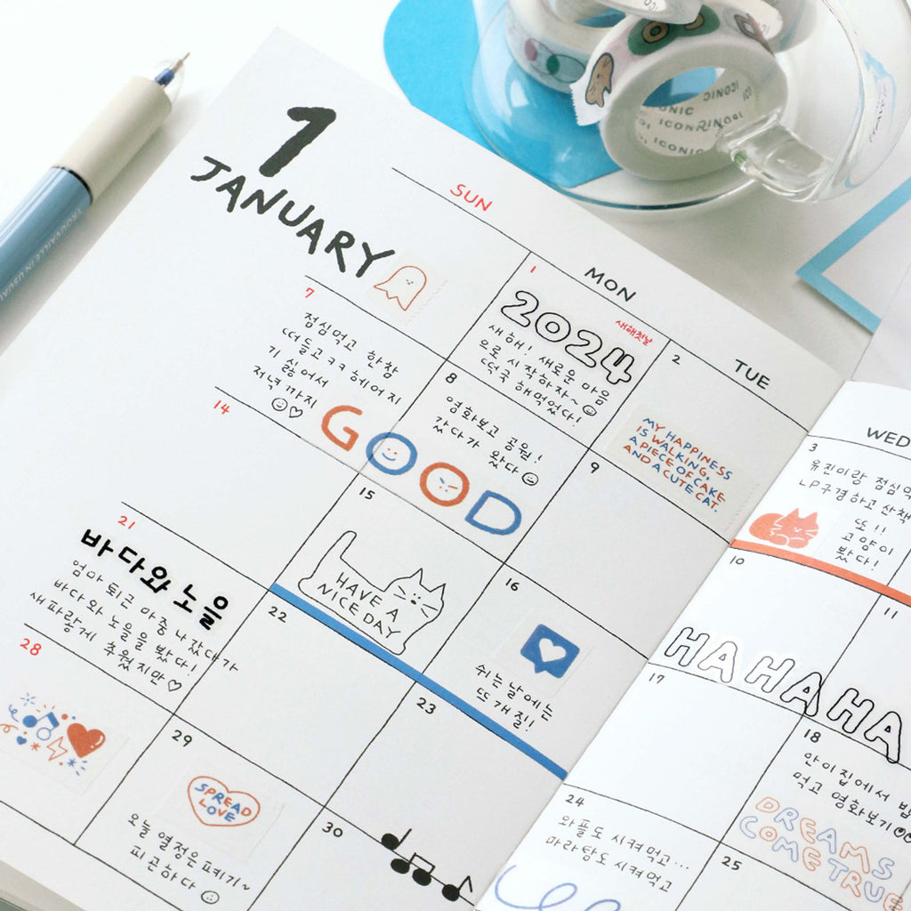 The Journal Shop - Planner decorated with strips of Iconic Doodle Masking Tape featuring small doodles and words.