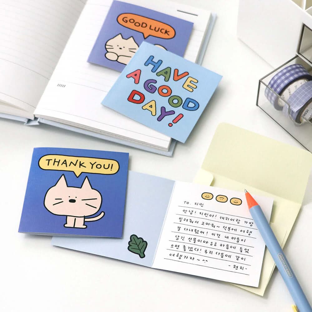 The Journal Shop - Open Iconic Doodle Mini Card Set showing cards and envelopes arranged neatly with writing accessories.