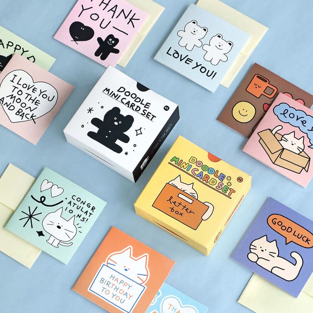 The Journal Shop - Iconic Doodle Mini Card Sets in assorted boxes and designs displayed together with envelopes and cards.