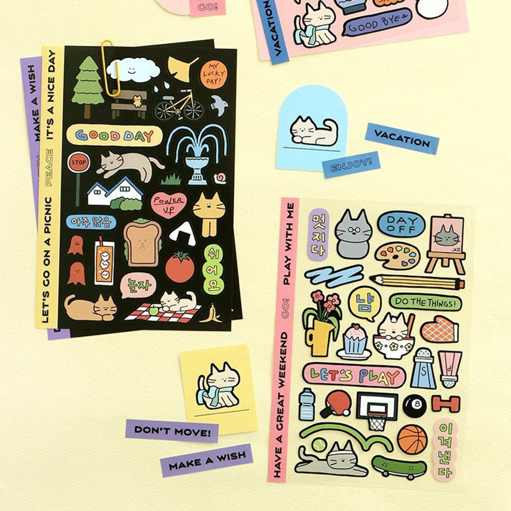The Journal Shop - Assorted Iconic Doodle Sticker sheets with cartoon-style designs arranged neatly on a yellow background.