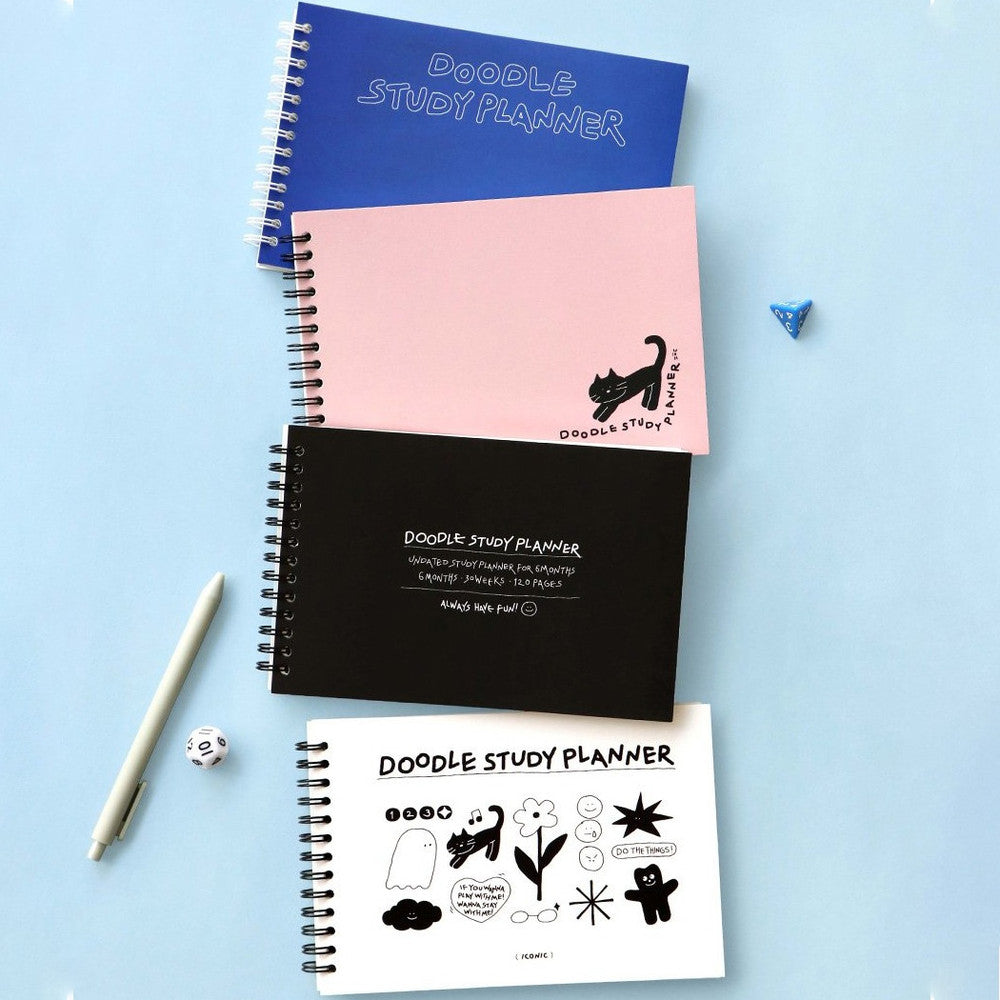 The Journal Shop - Collection of Iconic Doodle Study Planners in blue, pink, black, and white covers arranged on a light blue background with a pen.