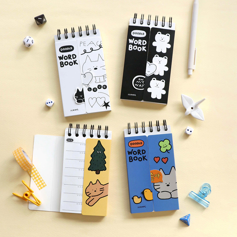 The Journal Shop - A set of Iconic Doodle Word Pocket Size Notebooks displayed on a desk.