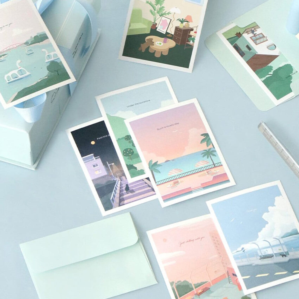 The Journal Shop - Iconic Haru Message Cards and envelopes in pastel blue and pink tones displayed neatly on desk.