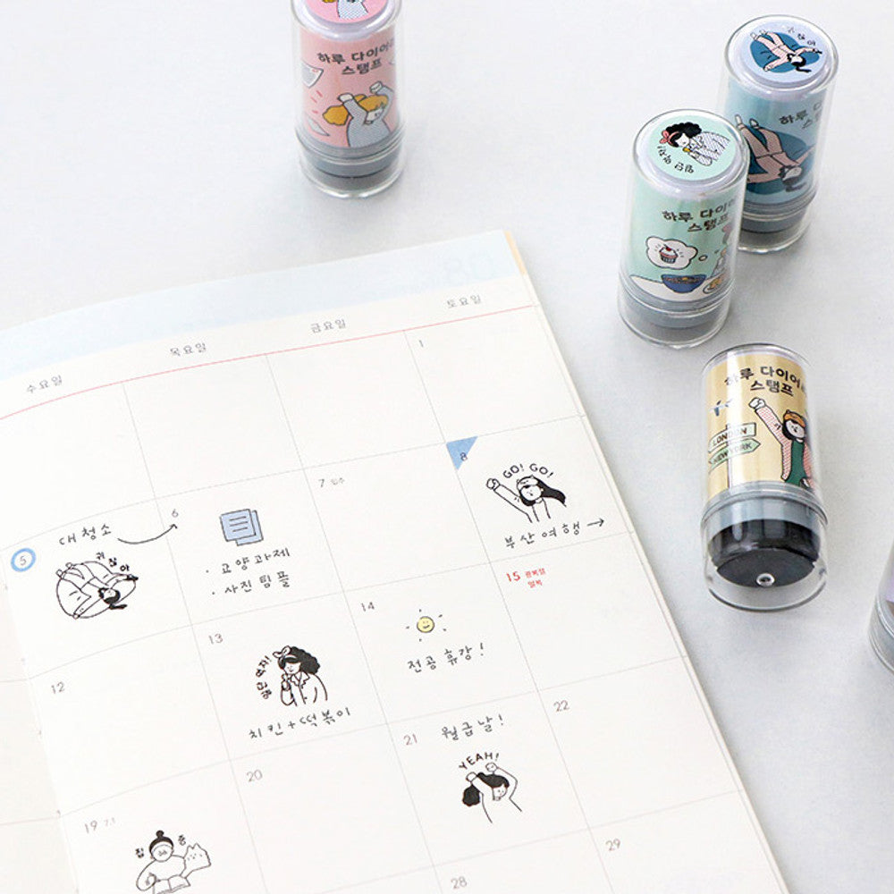 The Journal Shop - Close-up of pastel Haru Self-Inking Stamps used to decorate planner pages with cute character illustrations.