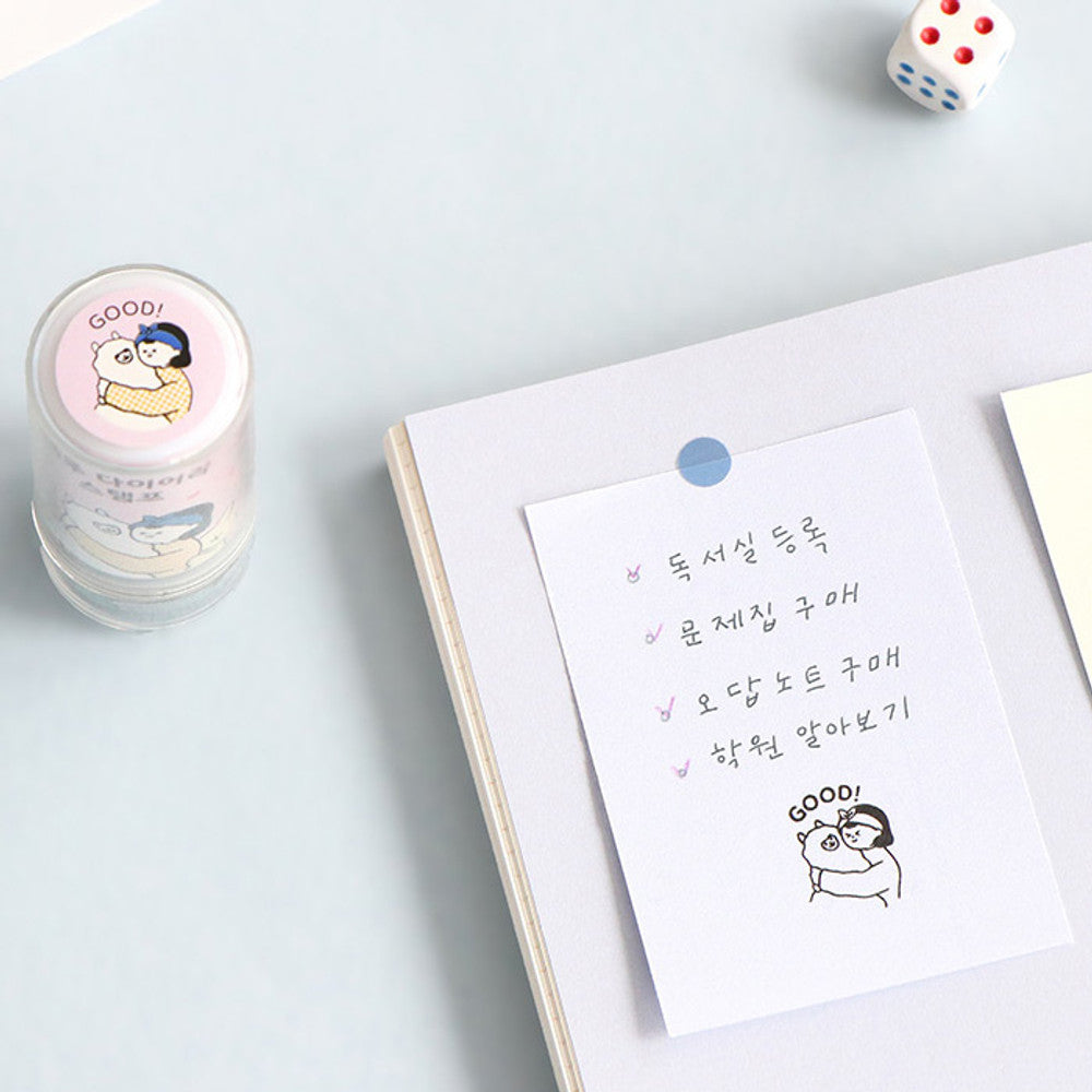 The Journal Shop - Planner with Haru Self-Inking Stamp impressions and pastel stamp designs placed beside it.