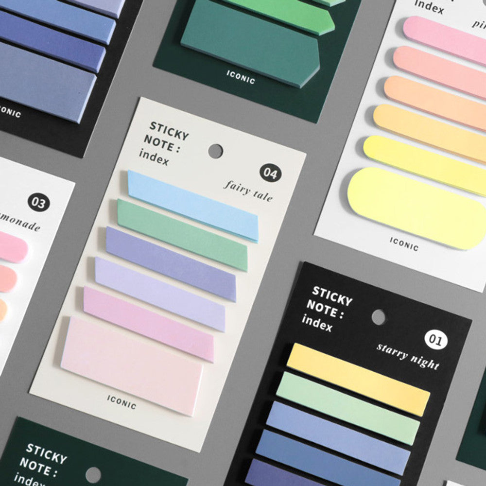 The Journal Shop - Collection of Iconic Index Colourful Sticky Note Sets in assorted pastel and deep hues arranged on a grey background.