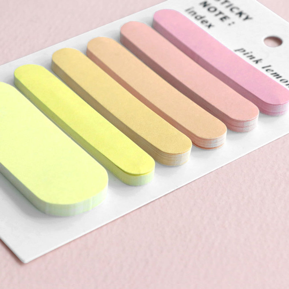 The Journal Shop - Set of pastel sticky notes on a pink background showing their soft gradient tones.