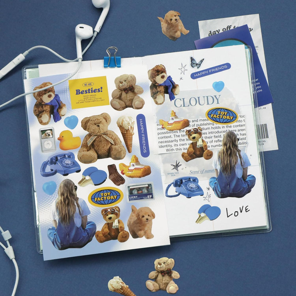 The Journal Shop - Set of sticker sheets with animals, food, and decor items arranged neatly on a blue background.