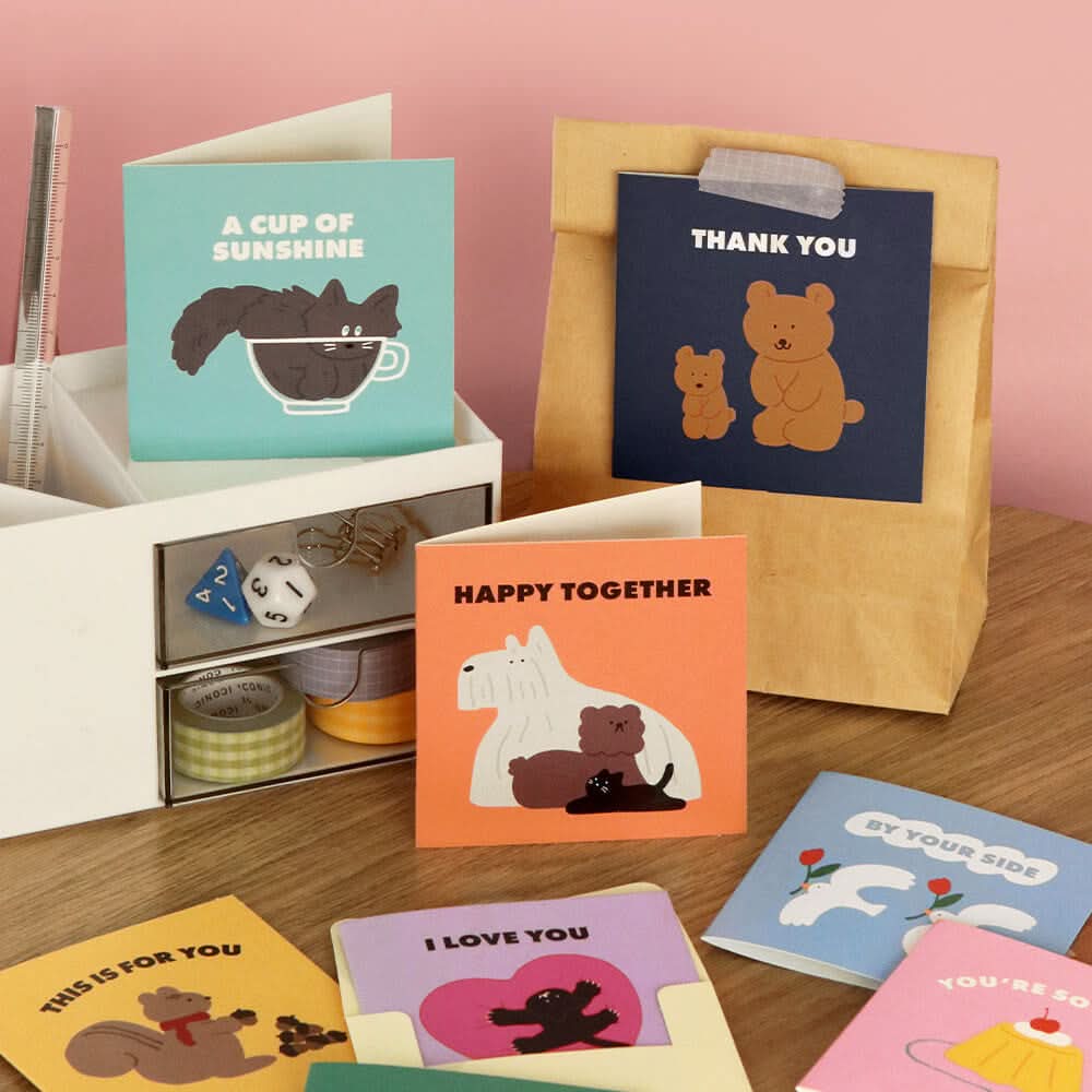 The Journal Shop - A selection of Iconic Mini Friends Cards displayed on a desk.