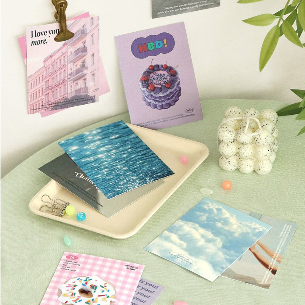 The Journal Shop - Iconic Moodscape Message Cards and envelopes arranged on light tray with decorative stickers and writing accessories.