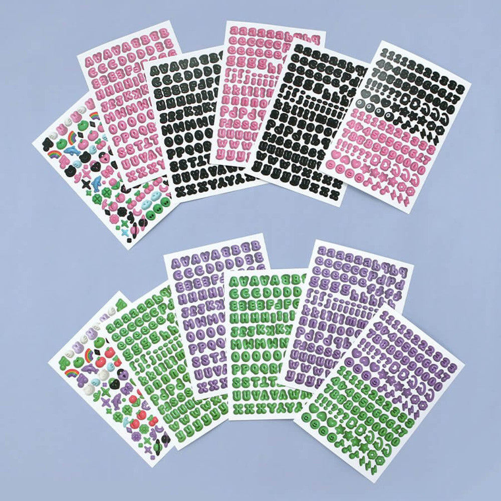 The Journal Shop - Several sets of Iconic Puffer Alphabet Stickers in different colours fanned out on a pastel blue background.
