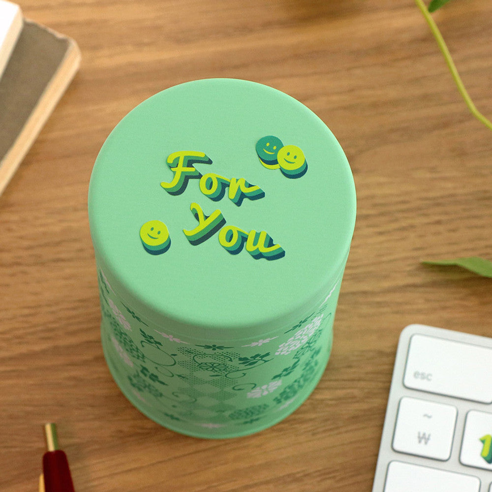 The Journal Shop - Individual green letter stickers forming phrases on a round mint-green container.