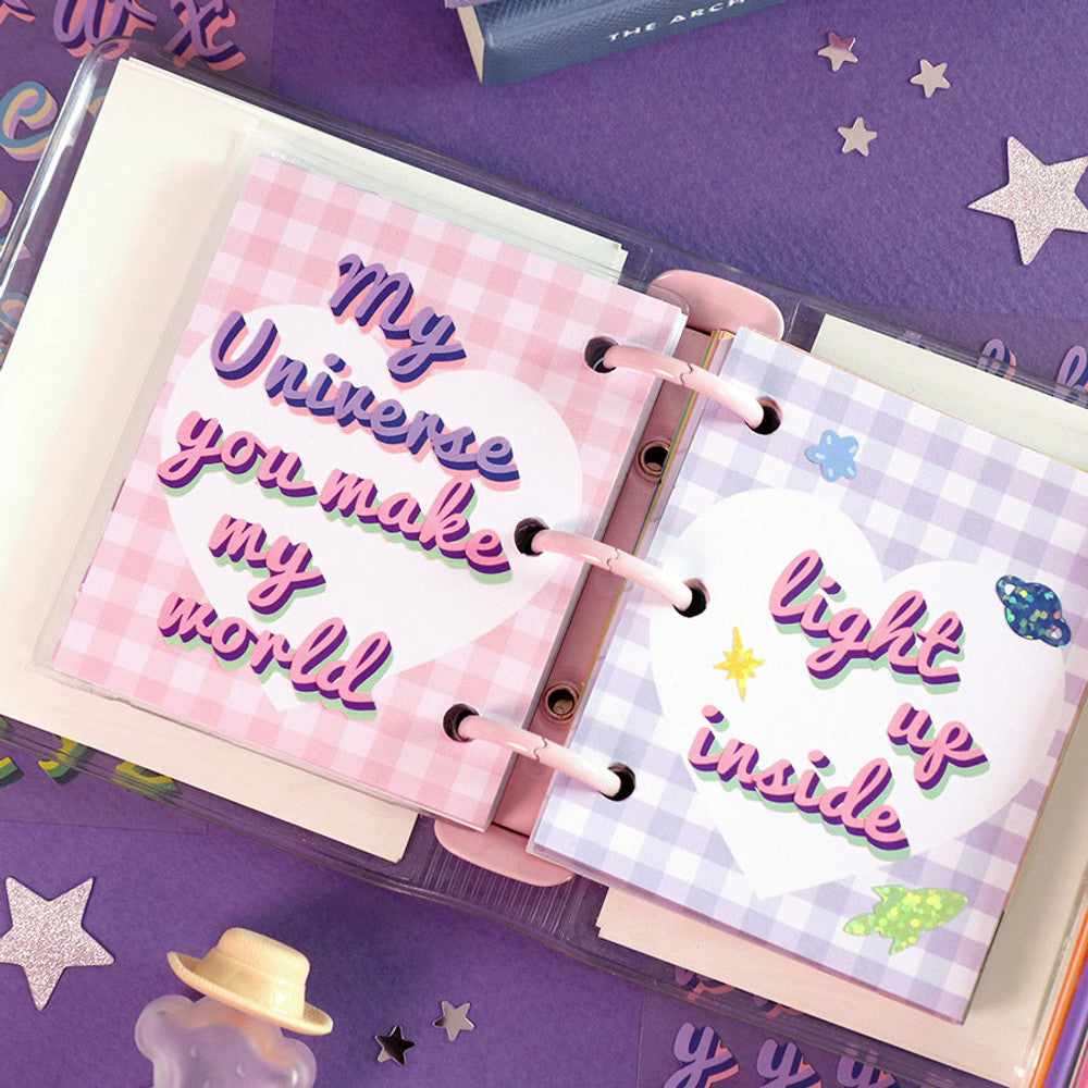 The Journal Shop - Open notebook decorated with colourful alphabet stickers spelling “My Universe” and “Self Note”.