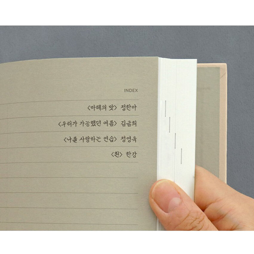 The Journal Shop - Iconic Solitude Tomoe River Line Notebook close-up of lined pages with neat handwriting.