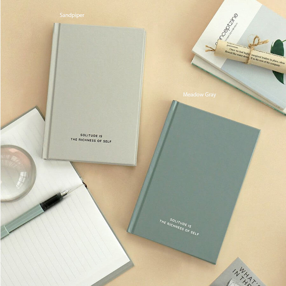 The Journal Shop - Iconic Solitude Tomoe River Line Notebooks in meadow grey and sandpiper colours open on a tidy workspace.