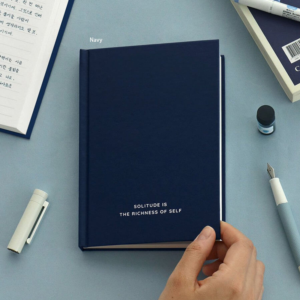 The Journal Shop - Iconic Solitude Tomoe River Line Notebook navy cover open with hand writing using fountain pen.