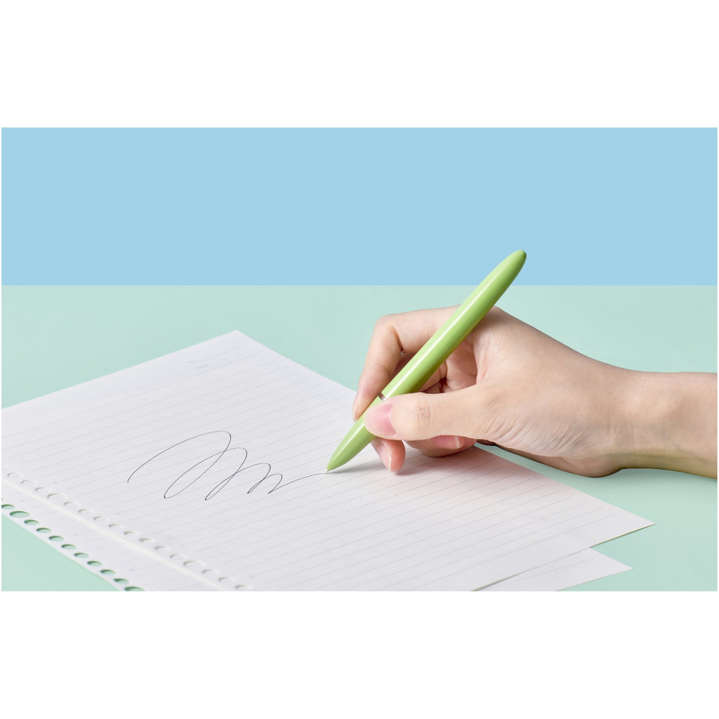 Hand writing with a green Kaco Retro fountain pen on white lined paper.