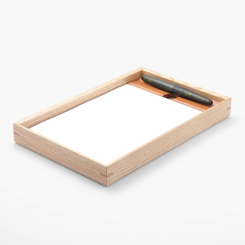 The Journal Shop - Angled view of the Kakimori A5 Writing Tray showing the smooth wooden surface and integrated pen rest.