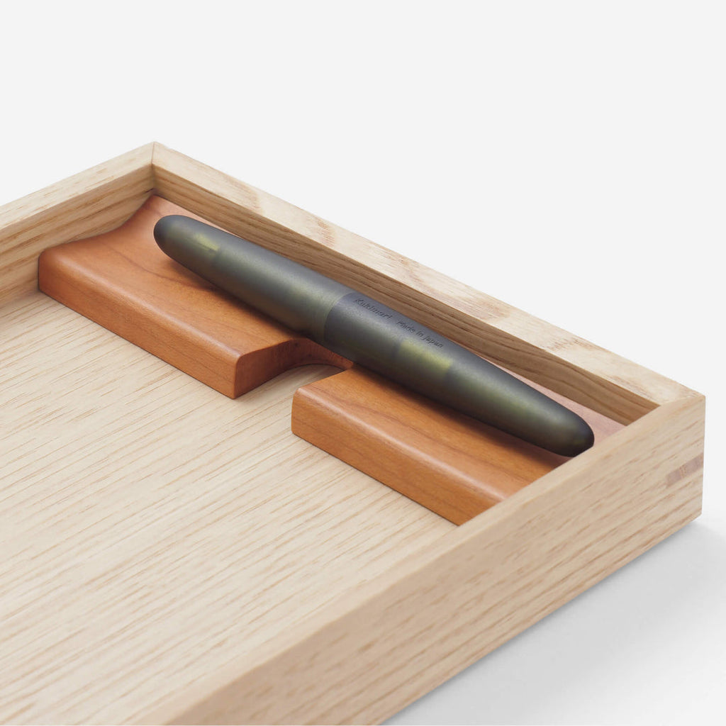 The Journal Shop - Detail view of the Kakimori tray’s pen holder with rounded slot and polished finish.