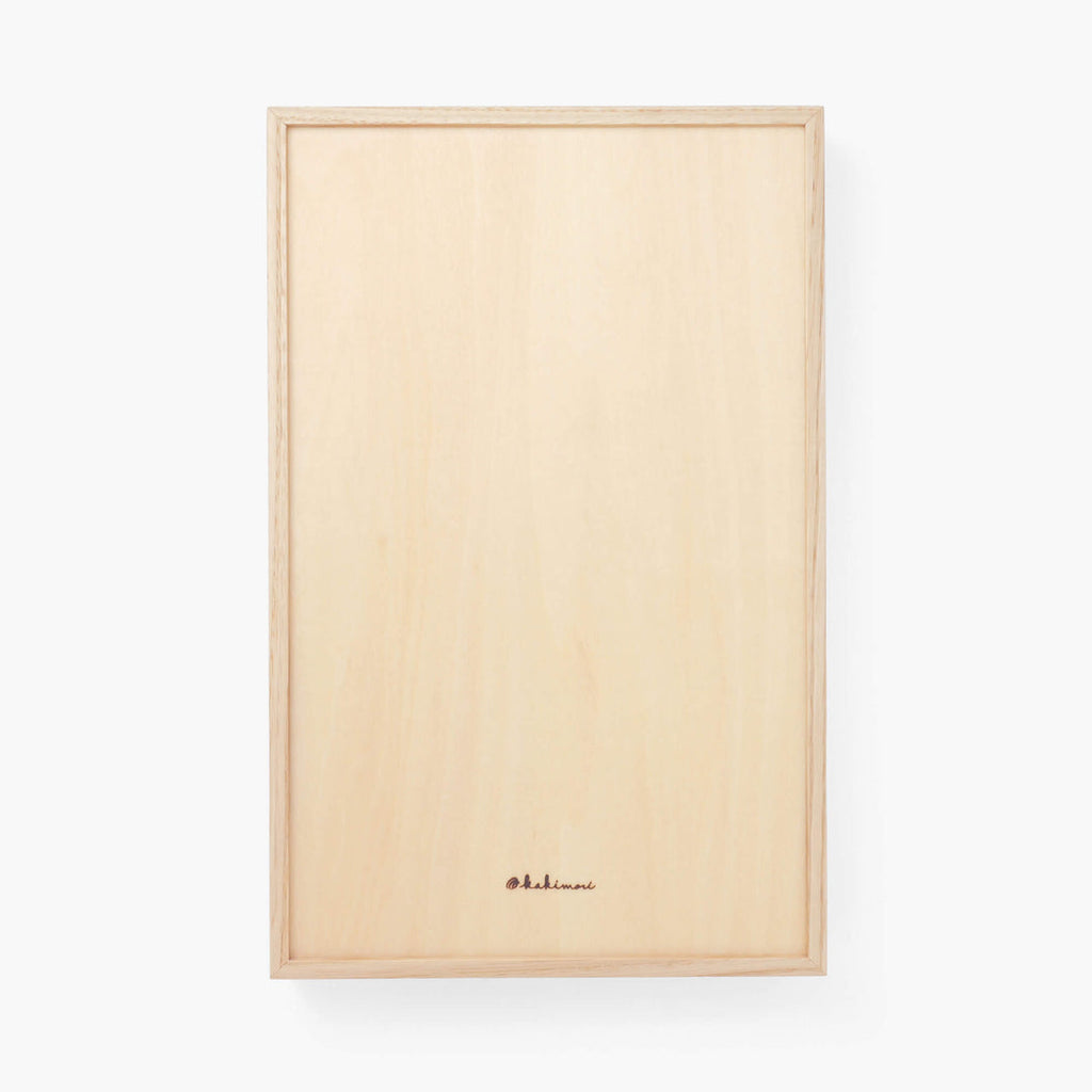 The Journal Shop - Underside of the Kakimori A5 Wooden Writing Tray featuring engraved branding and smooth finish.