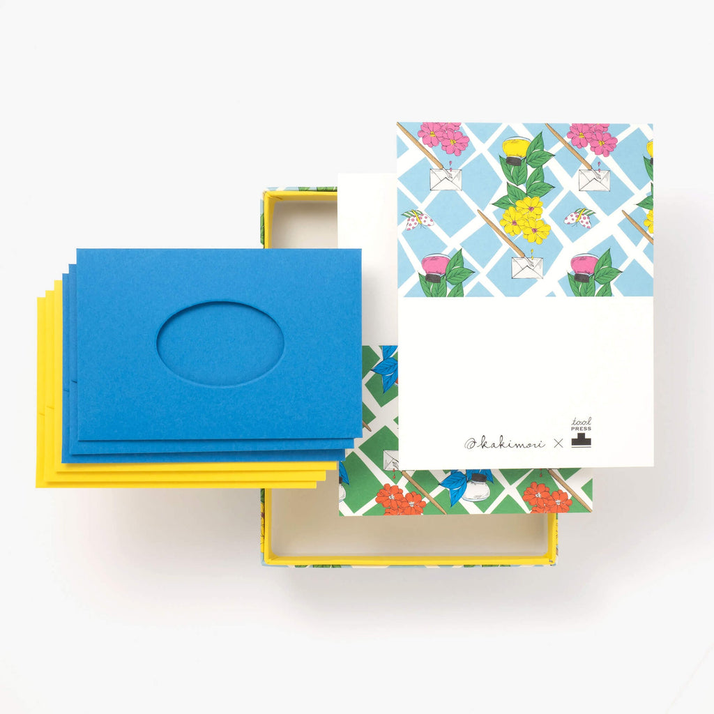The Journal Shop - Blue and yellow Kakimori Toolpress Magician envelopes displayed with matching patterned cards.