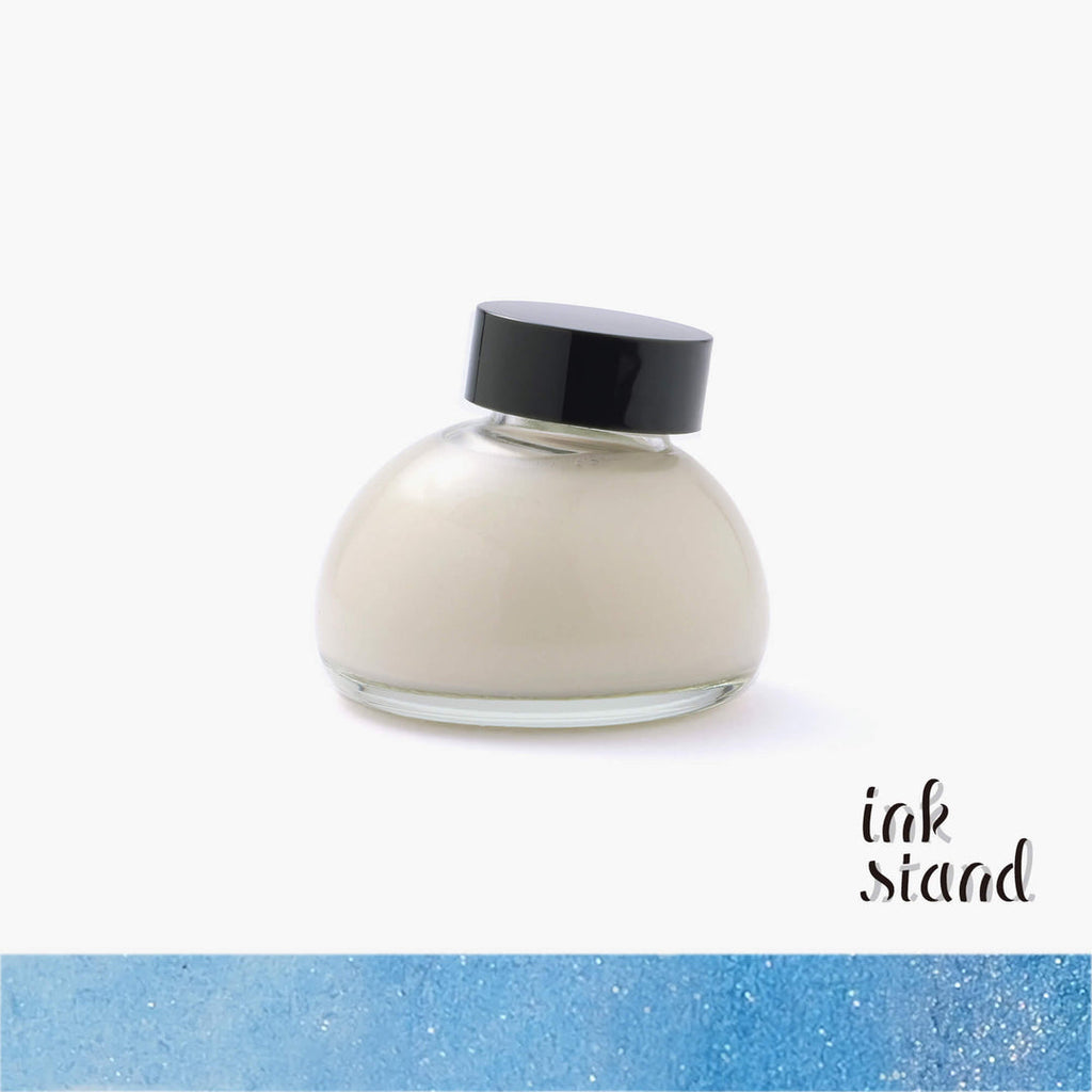 The Journal Shop -  Glass bottle of Kakimori Pearlescent Solution with a black cap, containing shimmering white liquid for custom ink blending.