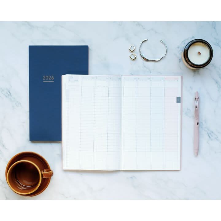 Angled view of Kokuyo Jibun Techo Lite 2026 Mini B6 Slim Diary showing slim binding and portable format.