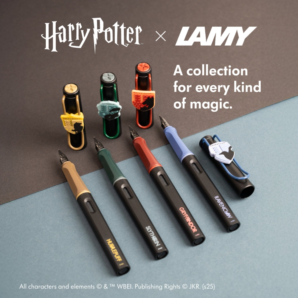 The Journal Shop - Four Lamy Safari Harry Potter Fountain Pens representing Hogwarts Houses — Hufflepuff, Slytherin, Gryffindor, and Ravenclaw — displayed with matching coloured clips and crests.