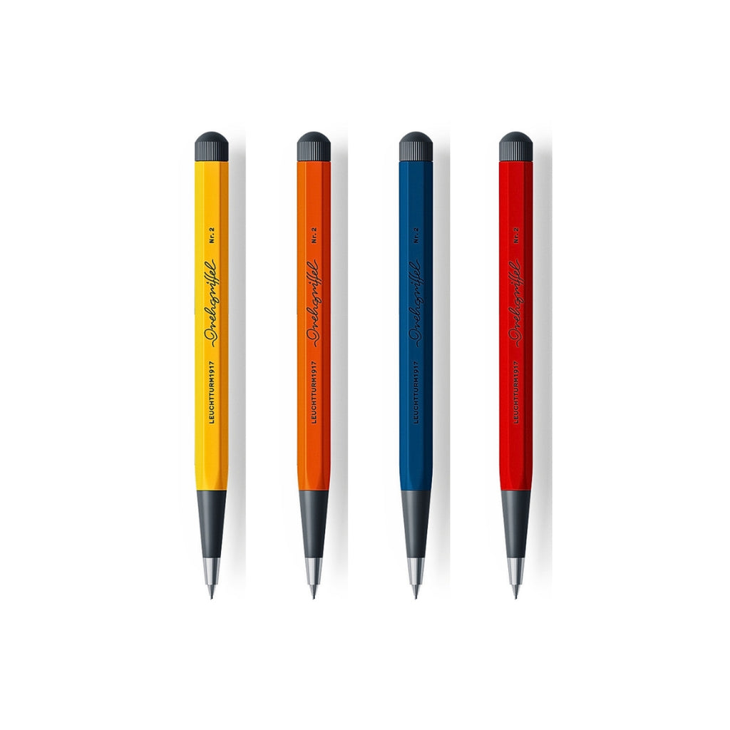 The Journal Shop - Four Leuchtturm1917 Drehgriffel Nr. 2 Mechanical Pencils in yellow, orange, blue, and red with black twist tops and metal tips.