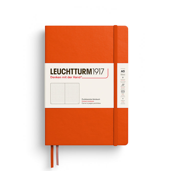 The Jounal Shop - Orange Leuchtturm1917 Medium Hardcover Dotted Notebook (A5) featuring an elastic strap, twin bookmarks, and ivory paper label wrap.