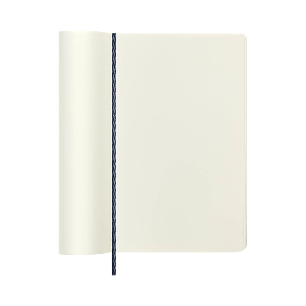 Open Moleskine notebook showing plain cream pages, ideal for sketching or writing.