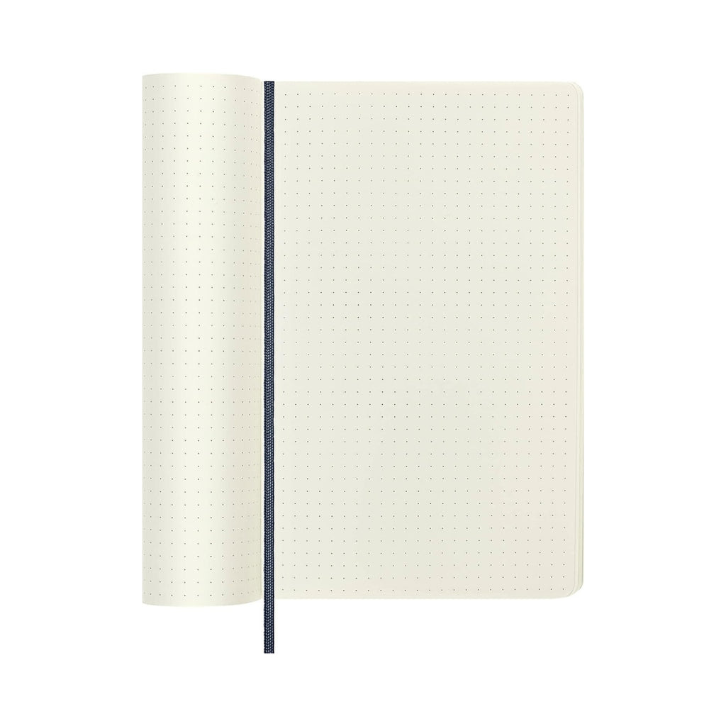 Open Moleskine notebook with dotted pages, suitable for planning or technical sketches.