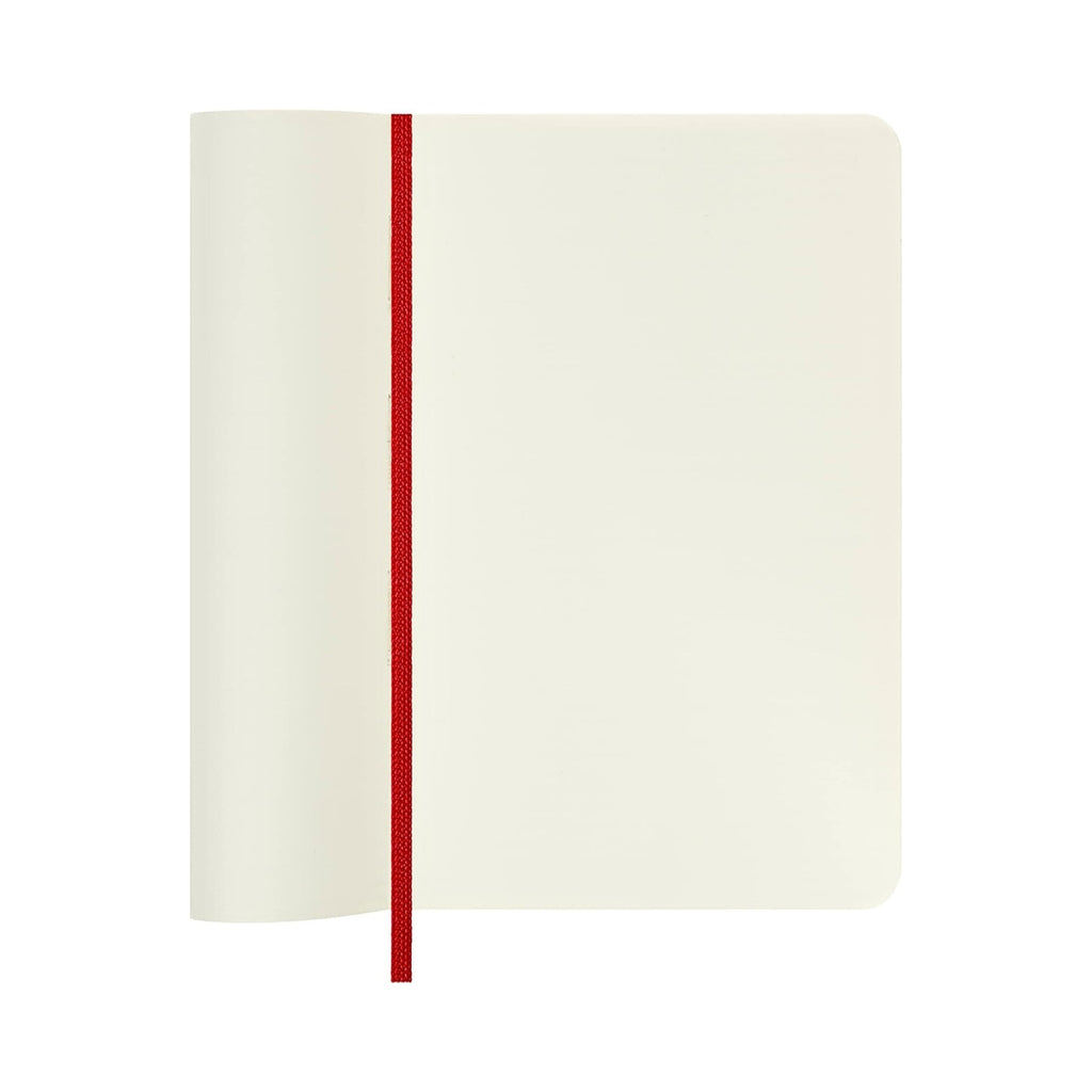 Open scarlet red Moleskine notebook showing inner page.