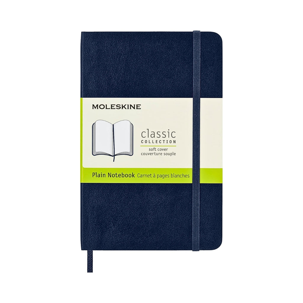 Single sapphire blue Moleskine Classic Pocket Soft Cover notebooks with paper bands.