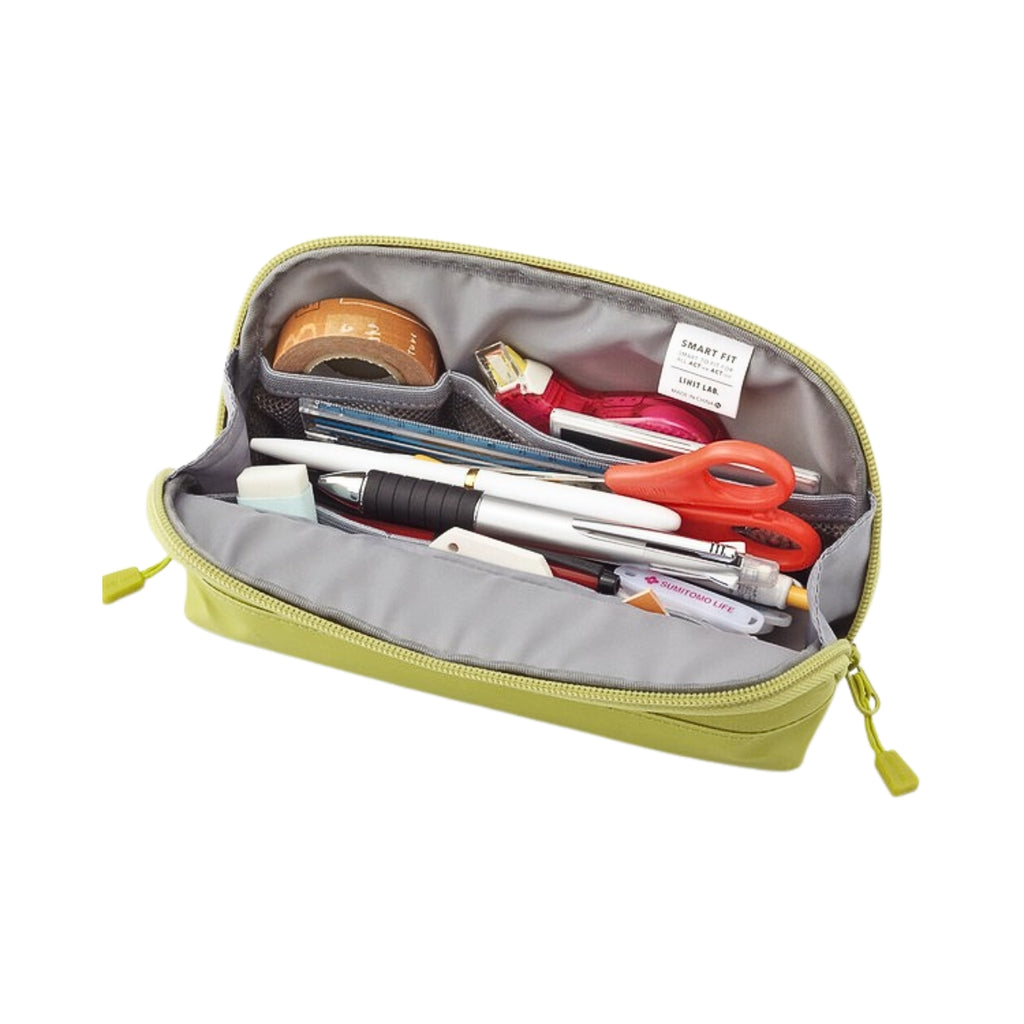 Interior of a light green Smart Fit pencil case, neatly filled with pens, scissors, washi tape, and stationery items.