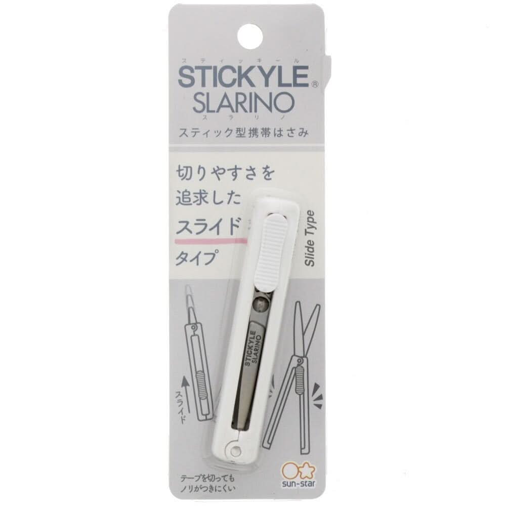 Sun-Star Slarino Stickyle white retractable scissors in original packaging with slide mechanism shown.