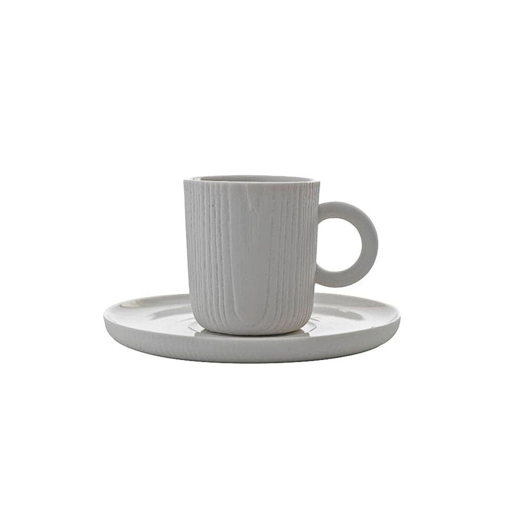 Toast Living MU espresso cup and saucer in white porcelain with a subtle wood-grain textured finish.
